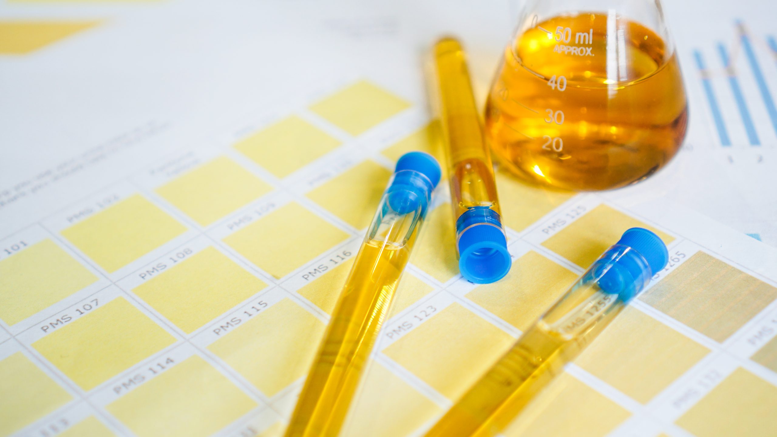 Flask and test tubes with urine on medical color schemes. Concept of analyzes
